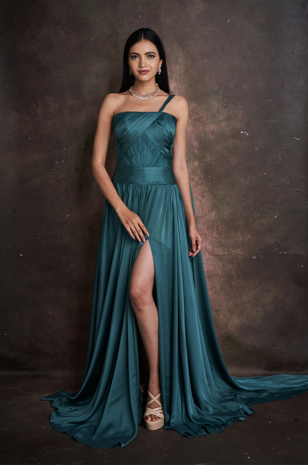 Pleated Gown with Dramatic Shoulder Cape